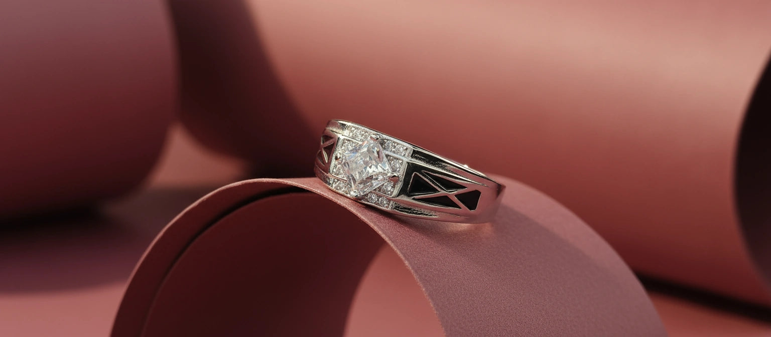 A men's 925 sterling silver statement ring with a central princess-cut cubic zirconia stone, pavé halo, and geometric black enamel details on the band.